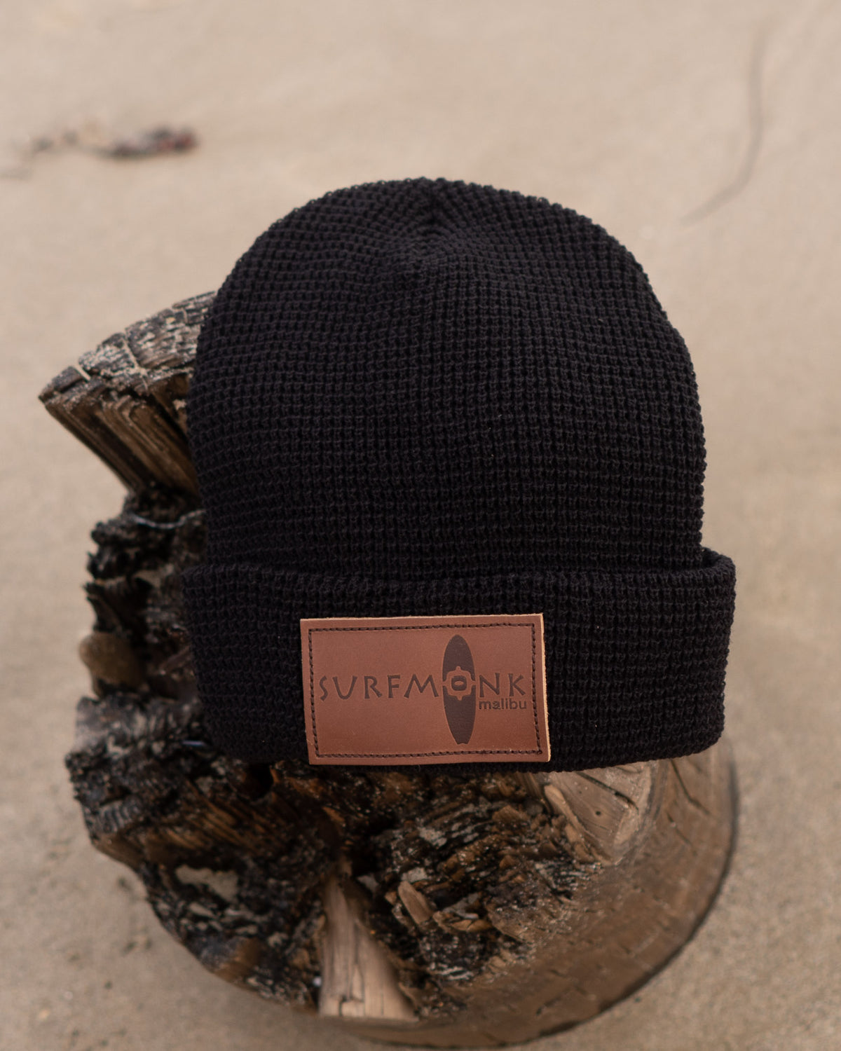 Beanie - Black Knit with embossed Surfmonk logo patch.